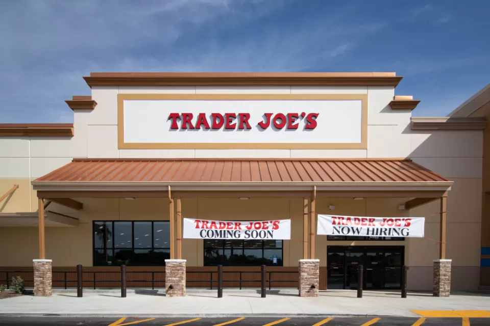 Trader Joe's building with "Coming Soon" and "Now Hiring" banners